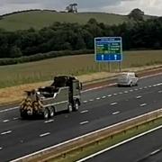 One vehicle in the convoy travelling on the M6