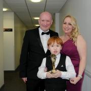 Claire with husband Neil and Jake at the Pride of St Helens Awards when Jake won the Child of Courage Award