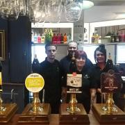 Licensee Anthony Murtagh (middle, back) and staff at the renovated Lamb