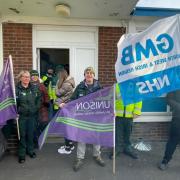 Emergency services workers on strike outside St Helens Ambulance Station