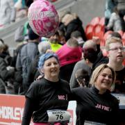 The moment she crossed the finish line, with sister-in-law Jayne