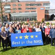 Ann Marr OBE, Chief Executive celebrates with staff from STHK