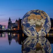 Floating Earth is located on Liverpool's Royal Albert Dock.