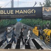 The mural outside of the Blue Mango restaurant
