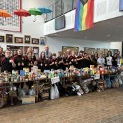Staff and students alongside their huge collection of food bank donations