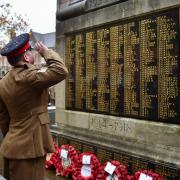 A soldier salutes the fallen in St Helens
