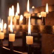 Generic image of candles in a church