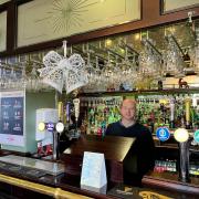 Mark behind the bar at the Commercial Hotel