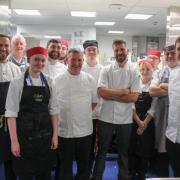 James Holden (middle) with chefs and St Helens College students at a fundraising dinner
