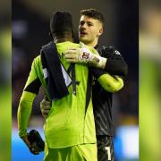 Sam Tickle embraces Manchester United goalkeeper Andre Onana after the cup tie