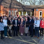 St Helens Borough Council elected members, staff and partners celebrate the opening of Central Link Family Hub with a ribbon cutting ceremony