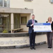 A cheque from Chapelhouse is presented to Willowbrook Hospice