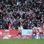 Tommy Makinson celebrates as the crowd in the West Stand goes wild