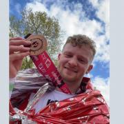 Taylor Prescott with his London Marathon medal