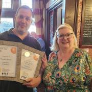 Turks Head landlord Darryl Arrowsmith being awarded the pub's CAMRA award