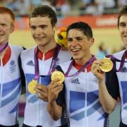 Ed Clancy, left, and the team with their gold medals. Picture by Tom Jenkins/NOPP
