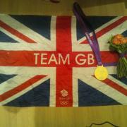 Pride of Britain: Ed Clancy shared this image, of his gold medal and a flag he was given by the crowd, with his Twitter followers.