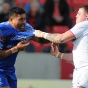 Samoa's Mose Masoe and England Knights' Brad Singleton come to blows in Saturday's clash at Salford. Picture by Mike Boden