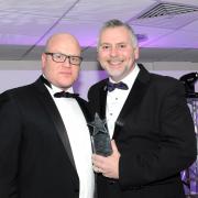 Drive and determination: Ian Smith (right) collects his award from sponsor Glen Moore