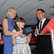 Melissa and mum Kathy receive their award from host George Riley