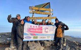 The friends at the top of Mount Kilimanjaro