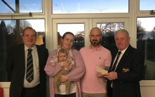 Representatives from the club joined Chris in presenting the cheque to Glenn and Becky and their five month old daughter Ruby